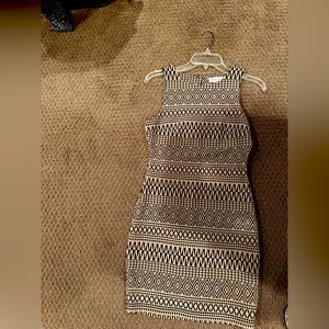 Skin tight tan and brown aztec design dress. SUPER cute on.